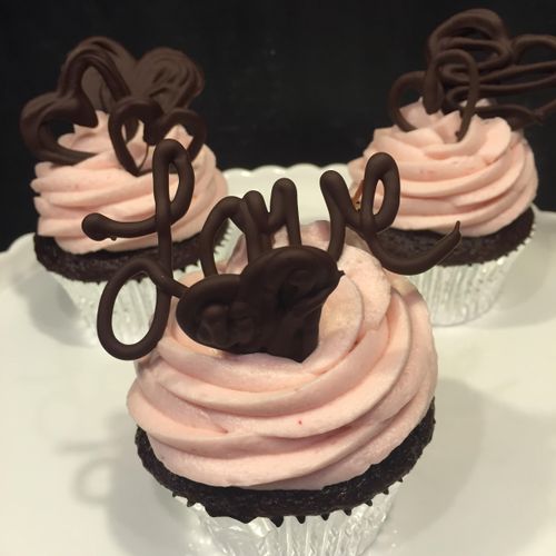 Chocolate raspberry cupcake topped with raspberry 