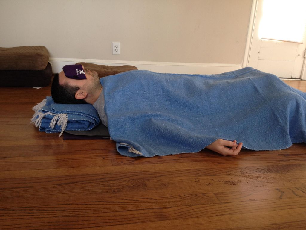 A client relaxing in Savasana at the end of practi