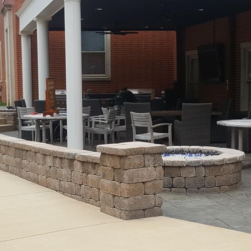 Fire pit, retaining wall, and outdoor kitchen.