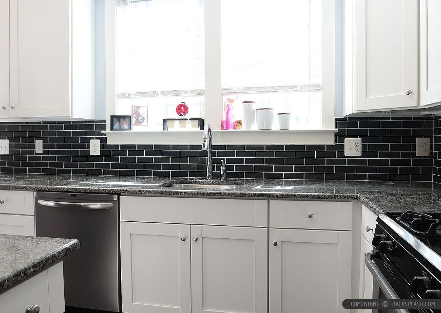 White Shaker cabinets with New Caledonia granite