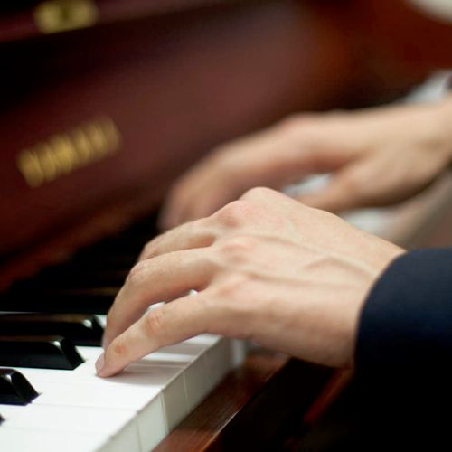 Teaching piano students in home or studio.