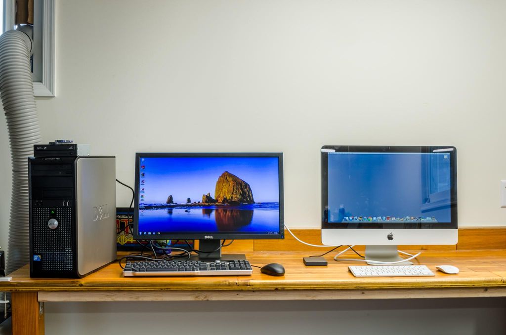 An older Dell with Windows 7 problems and an iMac.