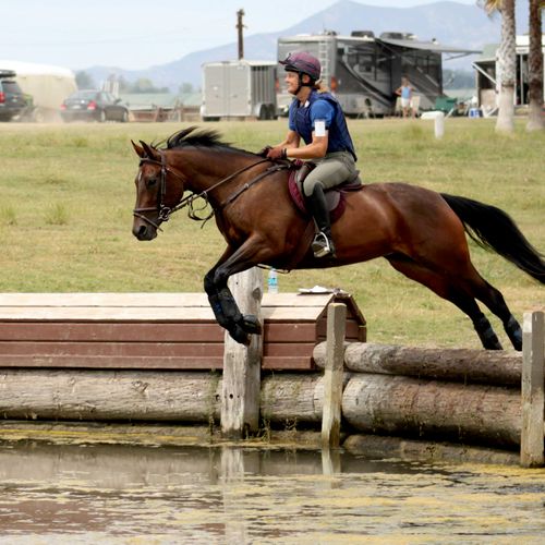 Training youngster jumping into water