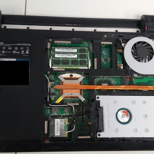 Replacing a CMOS battery in a laptop.