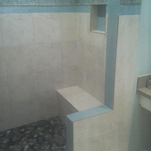 Custom shower using 18"X18" tiles with 4 types of 