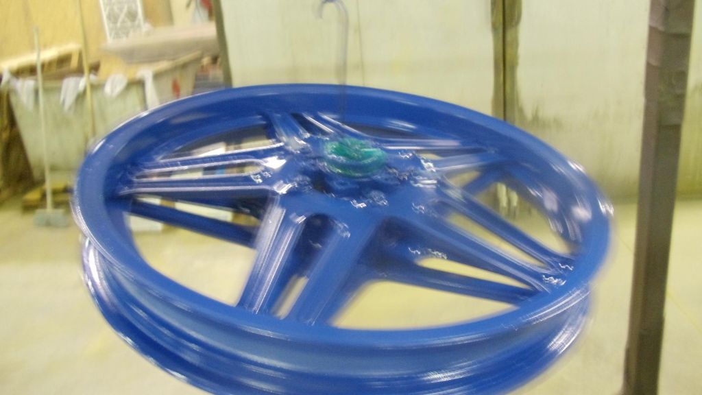 Honda Motorcycle rim powder coated blue.