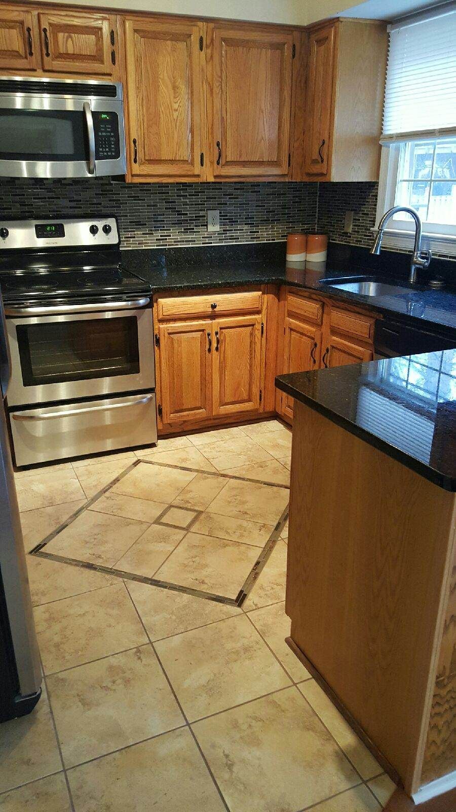 Replaced pink tile on kitchen floor.