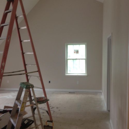 Painting job with high ceilings.
New Construction.