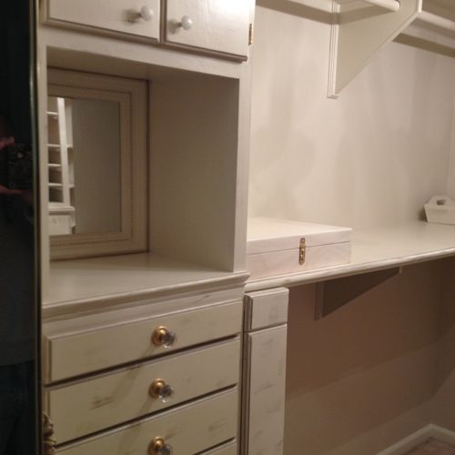 Walk-in closet, built custom finished cabinets and
