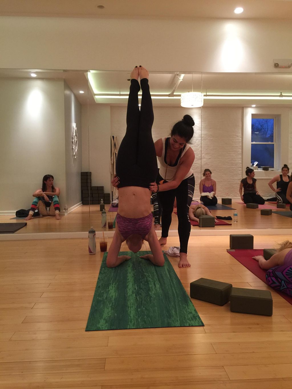 Assisting Jill in pincha mayurasana for her first 