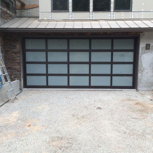 18ft wide by 8ft 3in height. Aluminum garage door.
