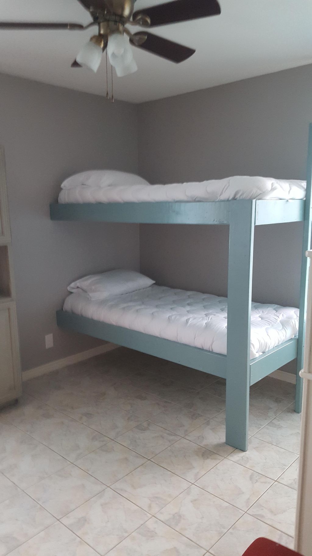 2 simple custom bunk beds attached to wall for max