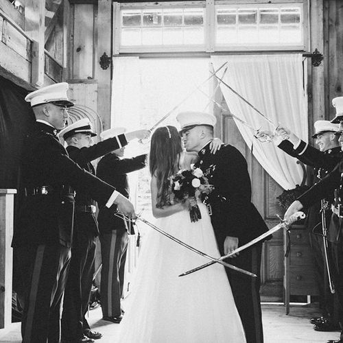 Sword Arch bride and groom introductions! Image by