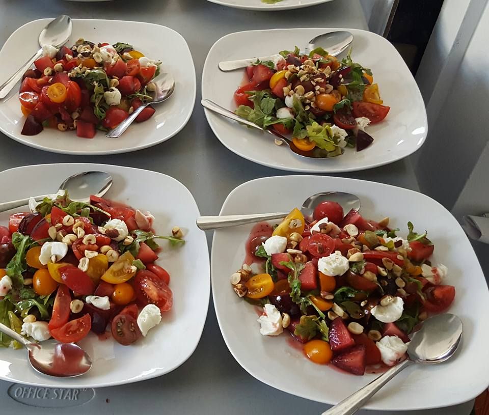 Tomatoes, pluot, & arugula salad with raspberry vi