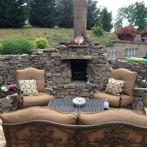 outdoor fireplace, mountain stone retaining wall, 