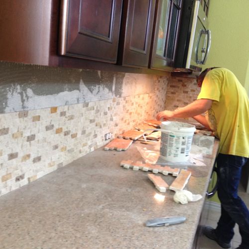 Removed the old backsplash and here I am Installin