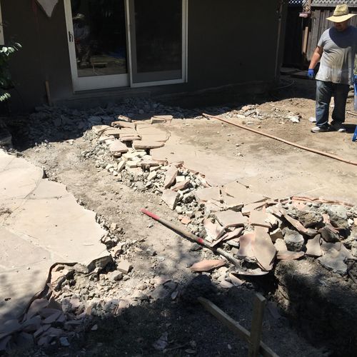 New foundation trenching and flagstone/concrete re