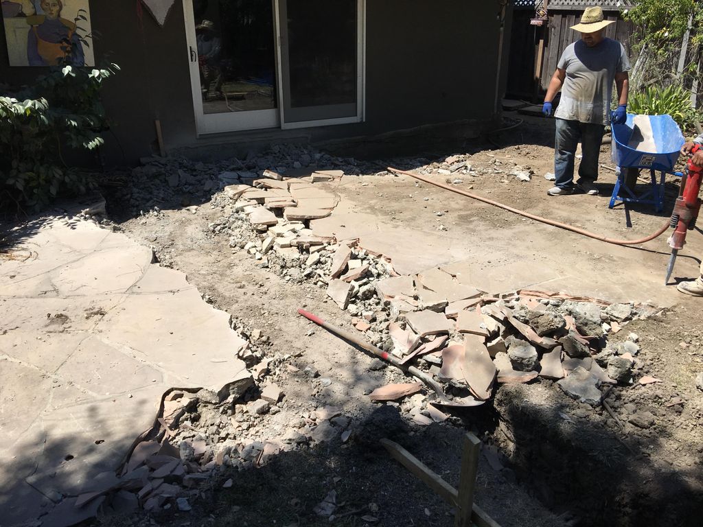 New foundation trenching and flagstone/concrete re