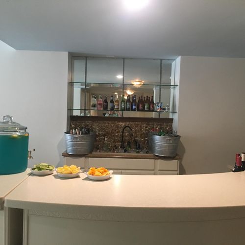 bar setup with a signature cocktail and garnishes 