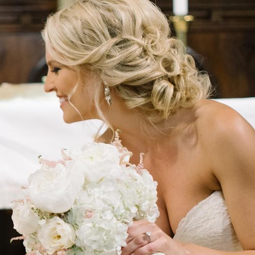 Updo, makeup, and eyelash extensions for bride.