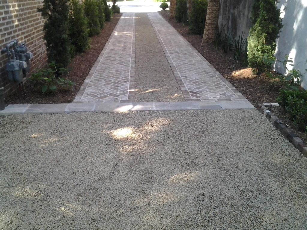 Split driveway with antique tumbled brick, herring