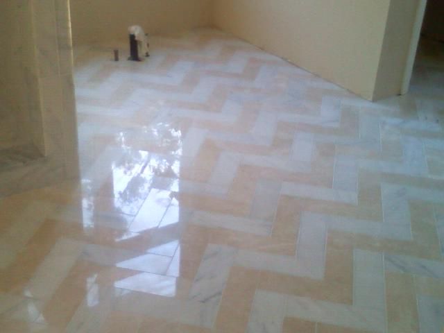 Hand cut custom herringbone pattern marble floor