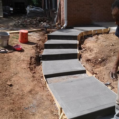 Concrete walk-way with enlayed stone