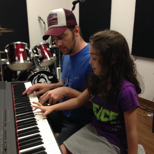 teaching one of my students how to play the Adele 