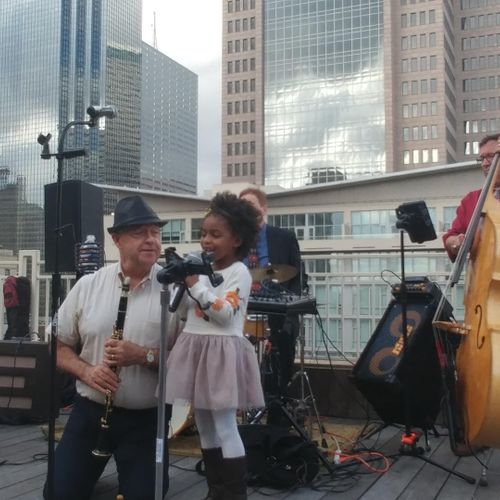 Rooftop downtown. Young singer joins the band