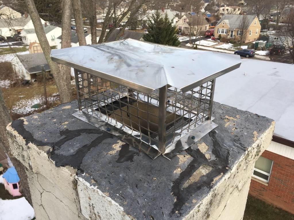 Chimney cap installation progress.