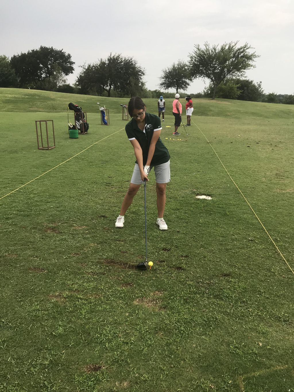 Picture of Isabella working on shoulder tilt with 