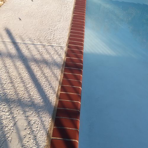Replaced brick tile and resurfaced pool deck.