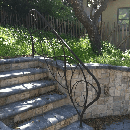 Artistic stair railing built to match customers de