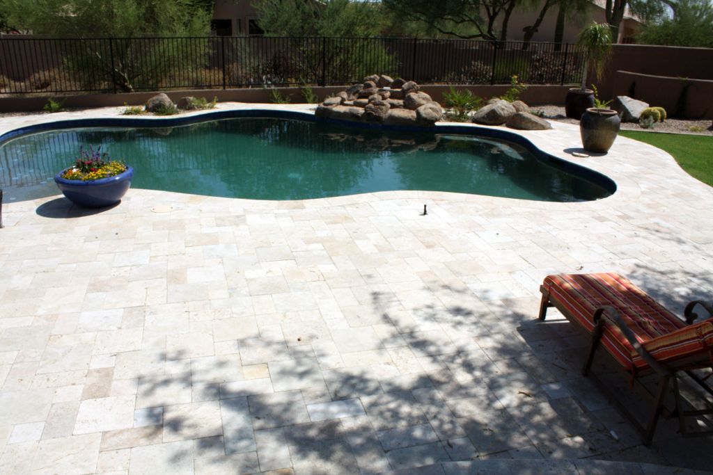 Travertine, Paver decking around the pool.