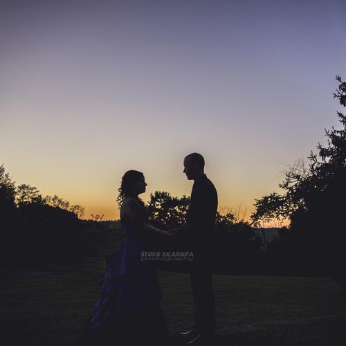 Bride and groom silhouette at sunset