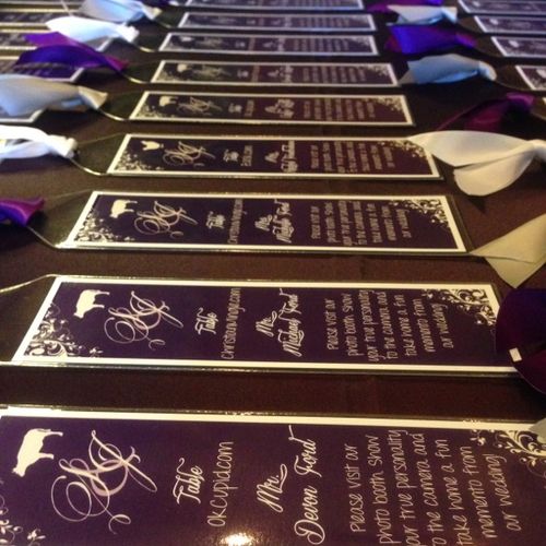Custom escort cards in bookmarks with purple and w