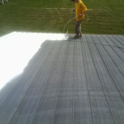 spraying a metal roof
