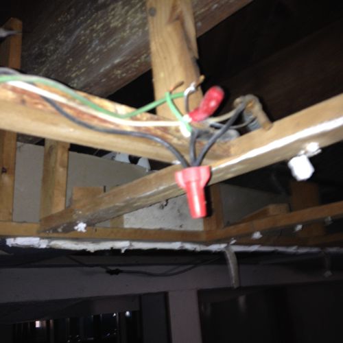 Exposed electrical wiring creating a safety hazard