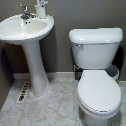 Bathroom Floor, Pedestal sink and Toilet installed