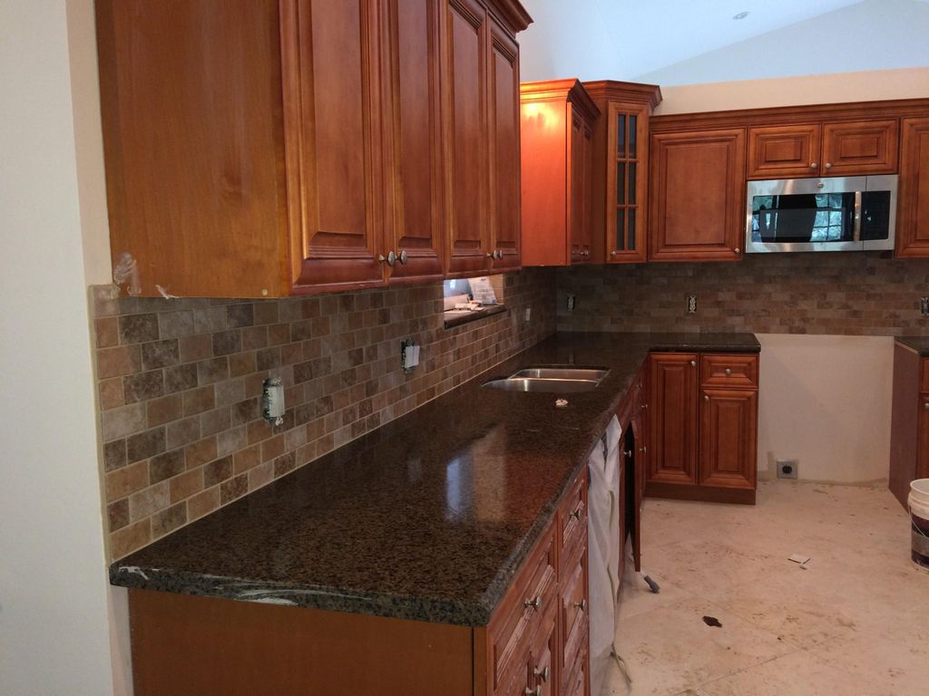 installed floor granite tops and backsplash