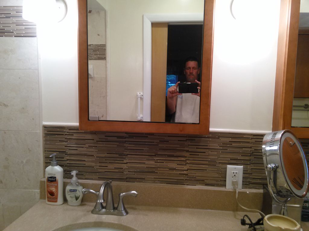 Glass tile backsplash and ceramic coping... cabine