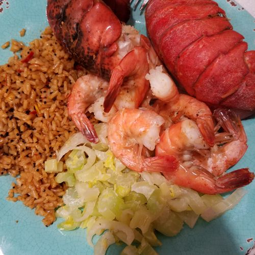 Two small lobster tails, shrimp, cooked celery wit