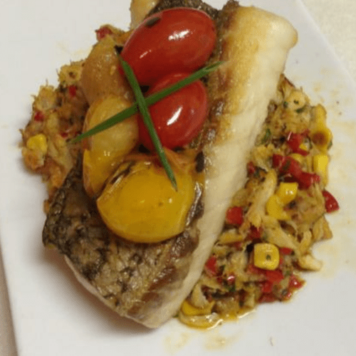 pan seared stripped bass with a warm blue crab and