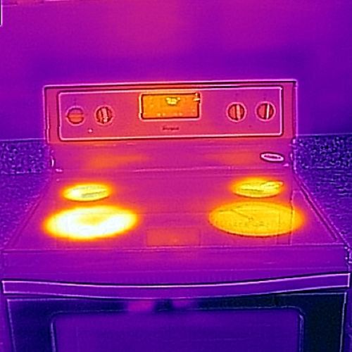 This shows an infrared thermal image of a stove wo