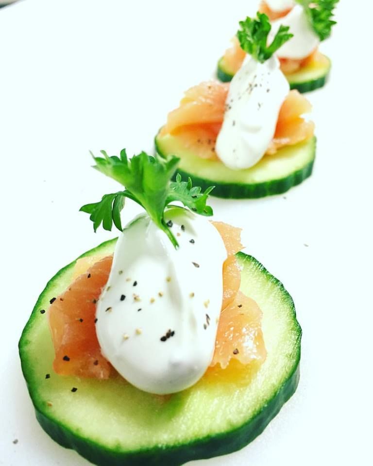 Smoked salmon on cucumber with dill cream.