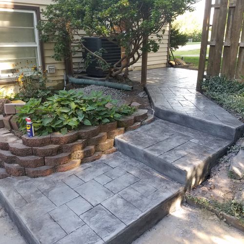 Stamped concrete patio leading to stairs