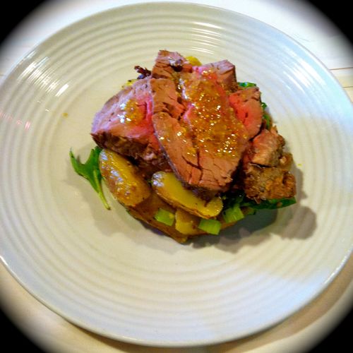 Beef tenderloin over a fingerling potato and spina