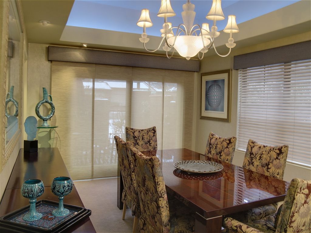 Dining Room with coffered illuminated ceiling and 