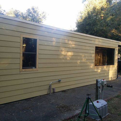 Demo and install new hardi plank siding and trim t