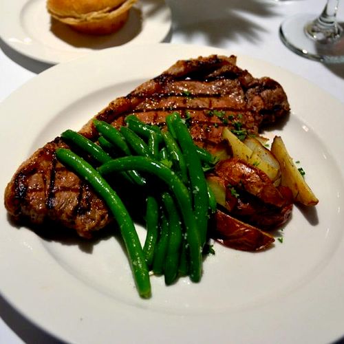 Strip Steak with fresh green beans and roasted red